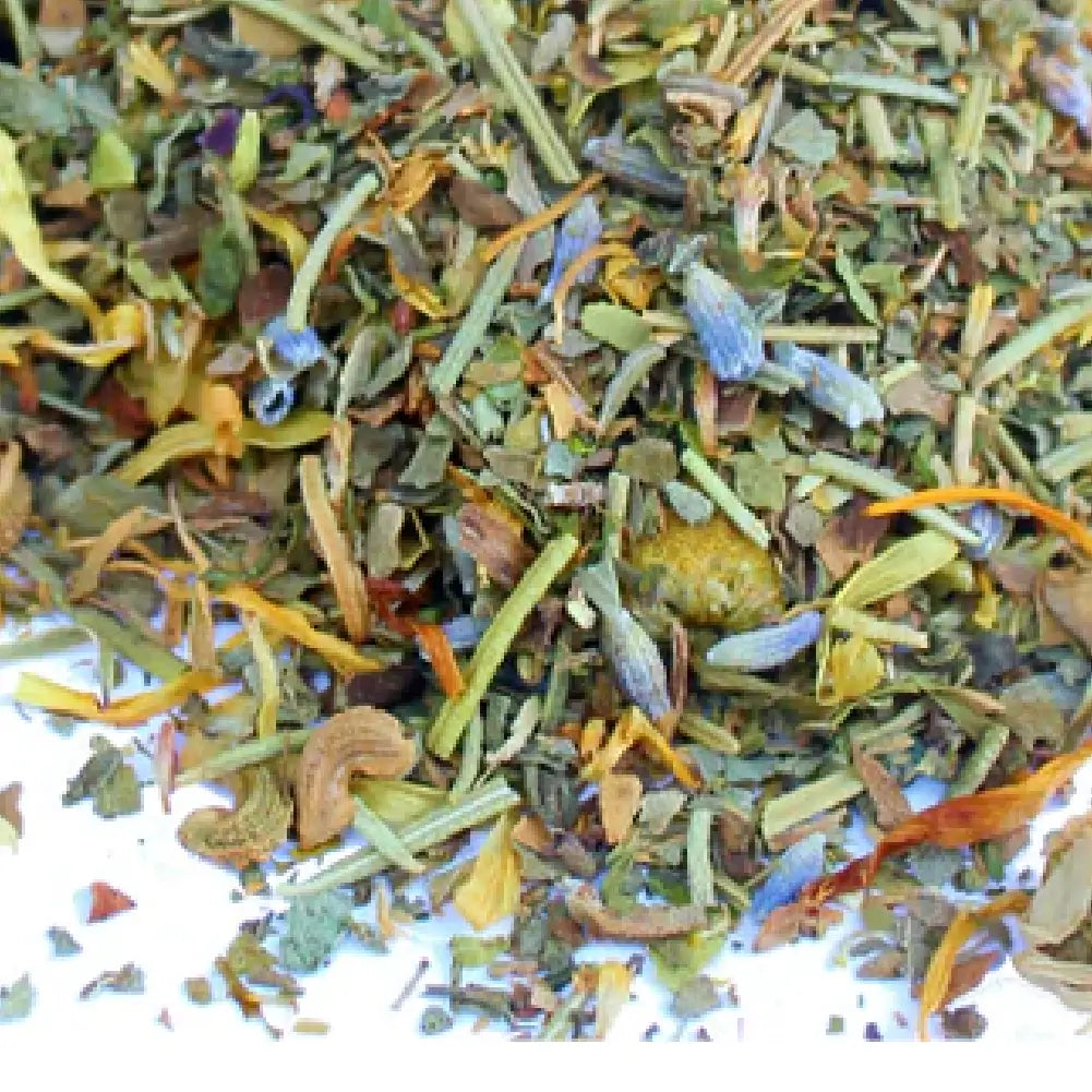 Pampered Chicken Mama organic nesting herbs packaging with dried flowers on a white background